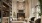 a large lounge with a fireplace and tv