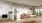 a large kitchen with white cabinets